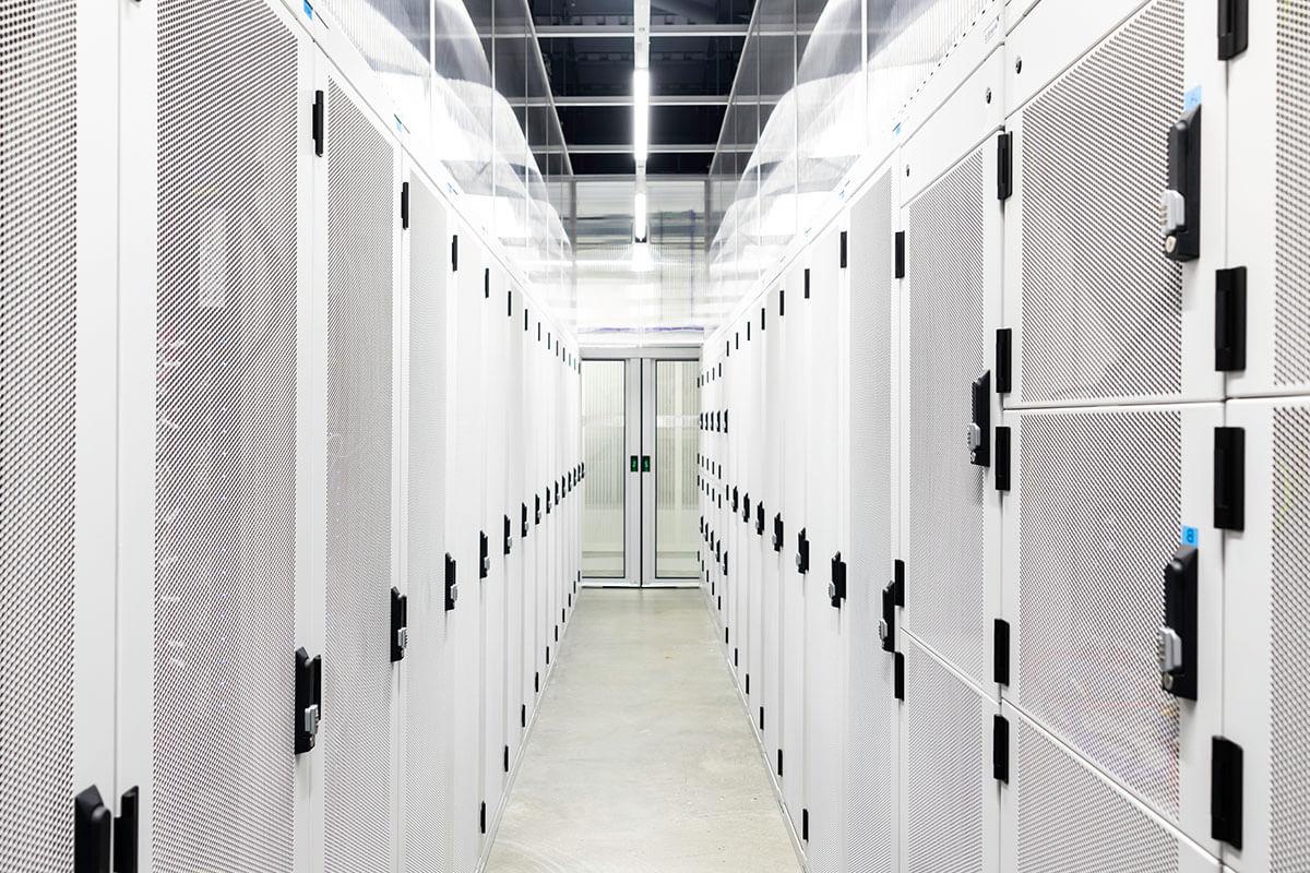 White corridor interior of cabinets in a data centre